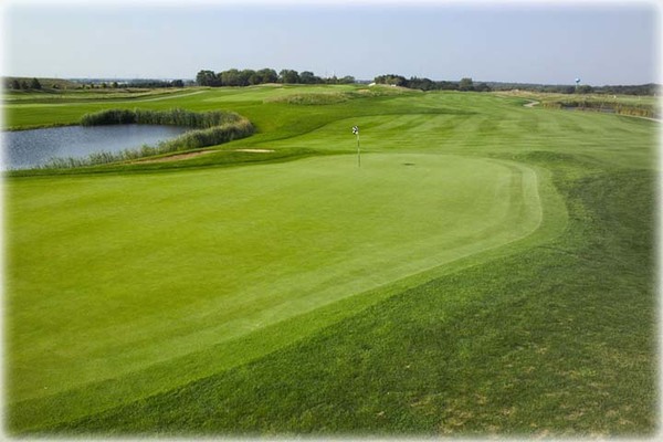 View of a hole next to a water hazard on the course at Shepherd's Crook